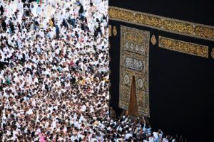 Pilgrims for the Hajj praying