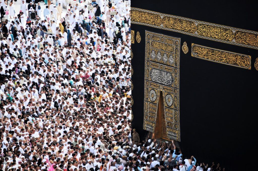 Pilgrims for the Hajj praying